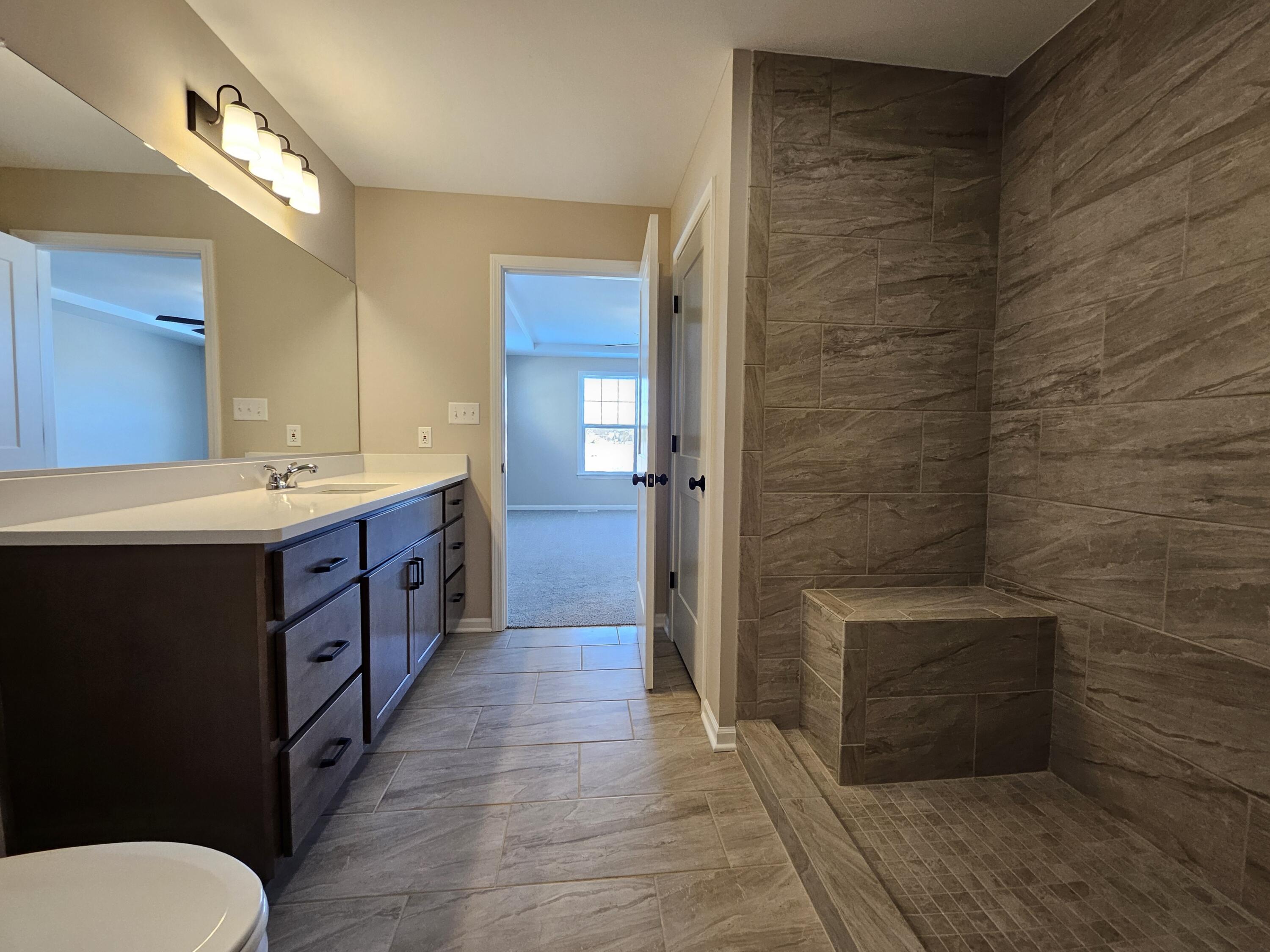 18348 Alexander Avenue Lowell, IN 46356 - Photo 28 of 46 a bathroom with a sink a toilet and shower