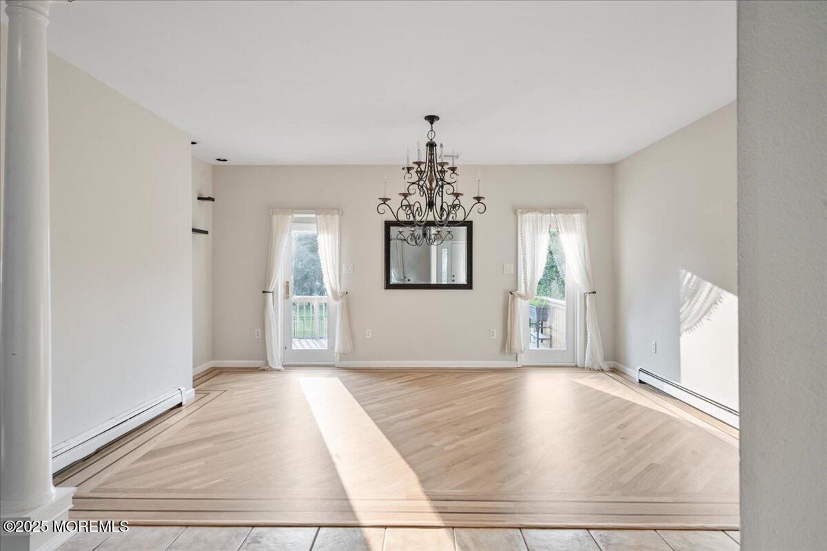 1621 Martin Road Neptune, NJ 07753 - Photo 13 of 54 wooden floor in an empty room with a window