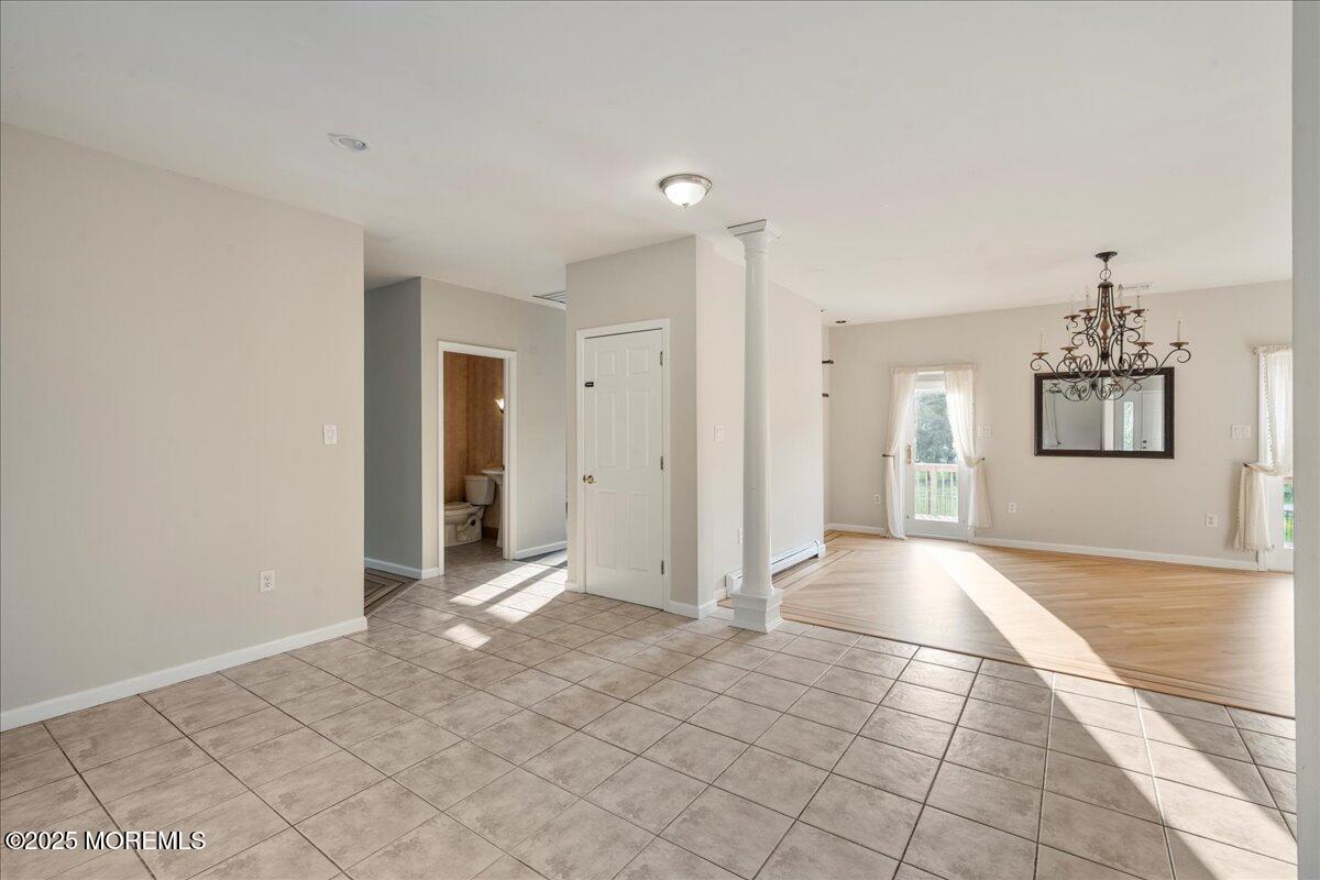 1621 Martin Road Neptune, NJ 07753 - Photo 14 of 54 a view of a big room with windows and chandelier fan