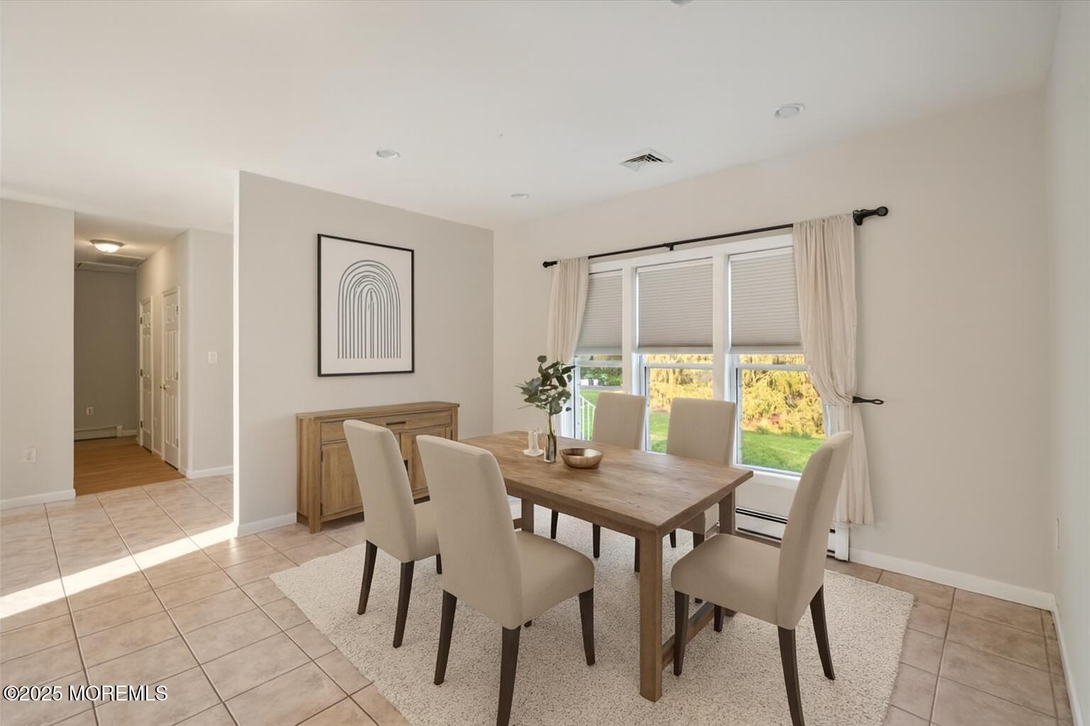 1621 Martin Road Neptune, NJ 07753 - Photo 15 of 54 a view of a dining room with furniture and a table and chair