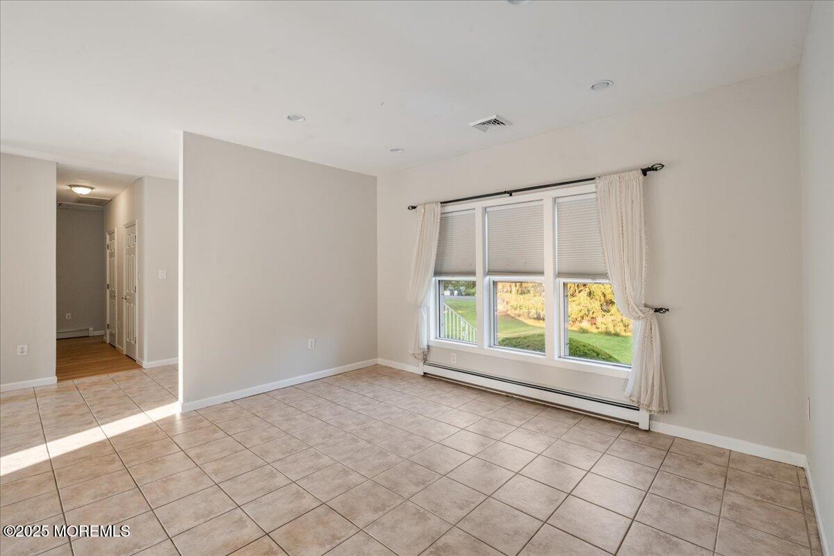 1621 Martin Road Neptune, NJ 07753 - Photo 16 of 54 an empty room with windows