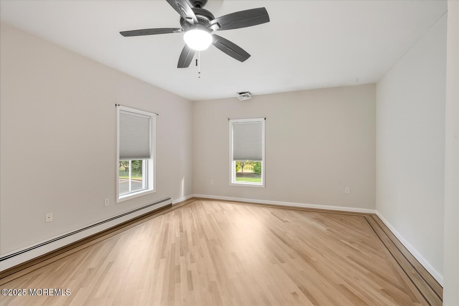 1621 Martin Road Neptune, NJ 07753 - Photo 19 of 54 wooden floor in an empty room with a window