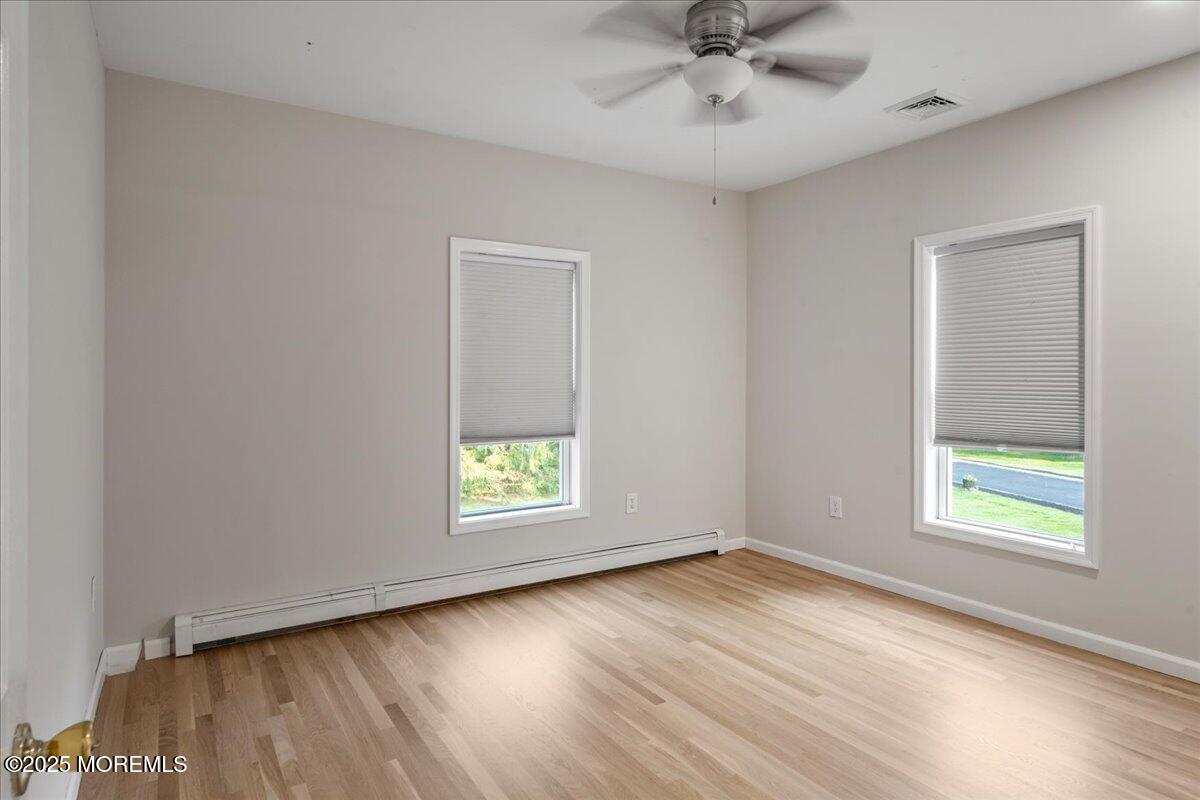 1621 Martin Road Neptune, NJ 07753 - Photo 21 of 54 an empty room with a window and a ceiling fan