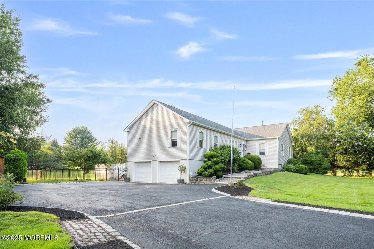 1621 Martin Road Neptune, NJ 07753 - Photo 3 of 54 a front view of a house with a yard and garage