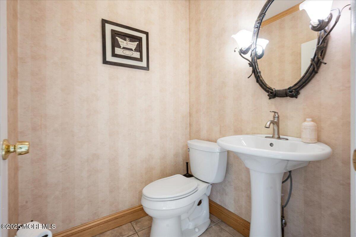 1621 Martin Road Neptune, NJ 07753 - Photo 31 of 54 a bathroom with a sink mirror and toilet