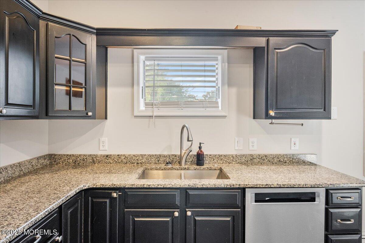 1621 Martin Road Neptune, NJ 07753 - Photo 36 of 54 a kitchen with granite countertop cabinets stainless steel appliances a sink and a window
