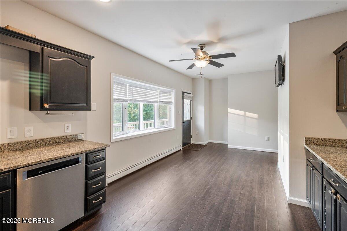 1621 Martin Road Neptune, NJ 07753 - Photo 37 of 54 a view of an empty room with a kitchen and a window