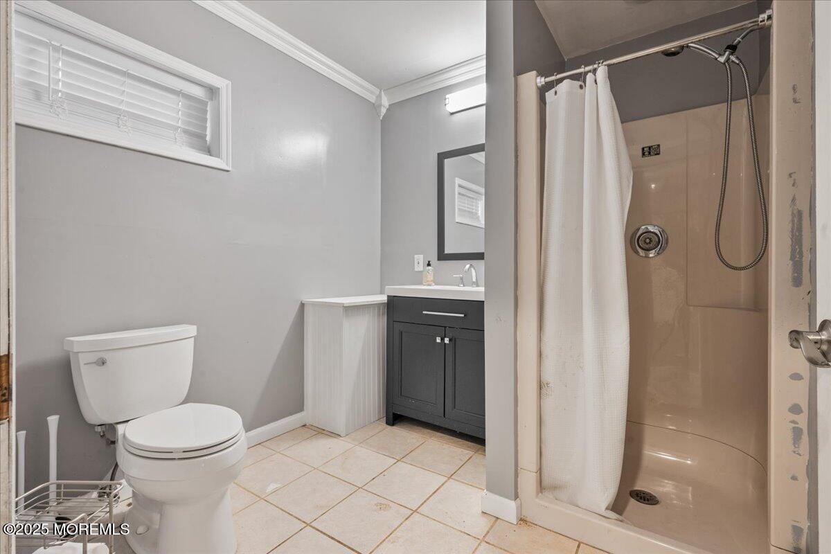 1621 Martin Road Neptune, NJ 07753 - Photo 39 of 54 a bathroom with a toilet and a shower