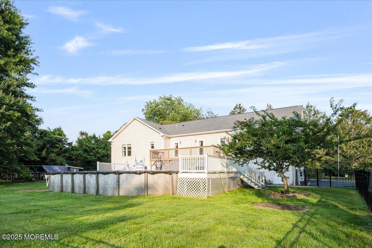 1621 Martin Road Neptune, NJ 07753 - Photo 48 of 54 a view of a white house with a big yard and large trees