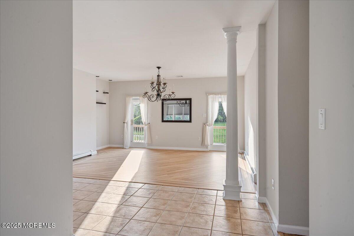 1621 Martin Road Neptune, NJ 07753 - Photo 8 of 54 a view of a hallway with wooden floor and a bathroom