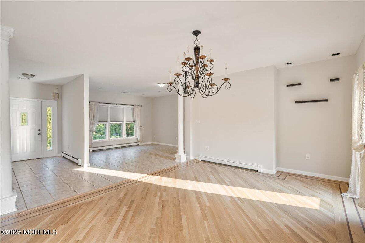 1621 Martin Road Neptune, NJ 07753 - Photo 10 of 54 an empty room with wooden floor and windows