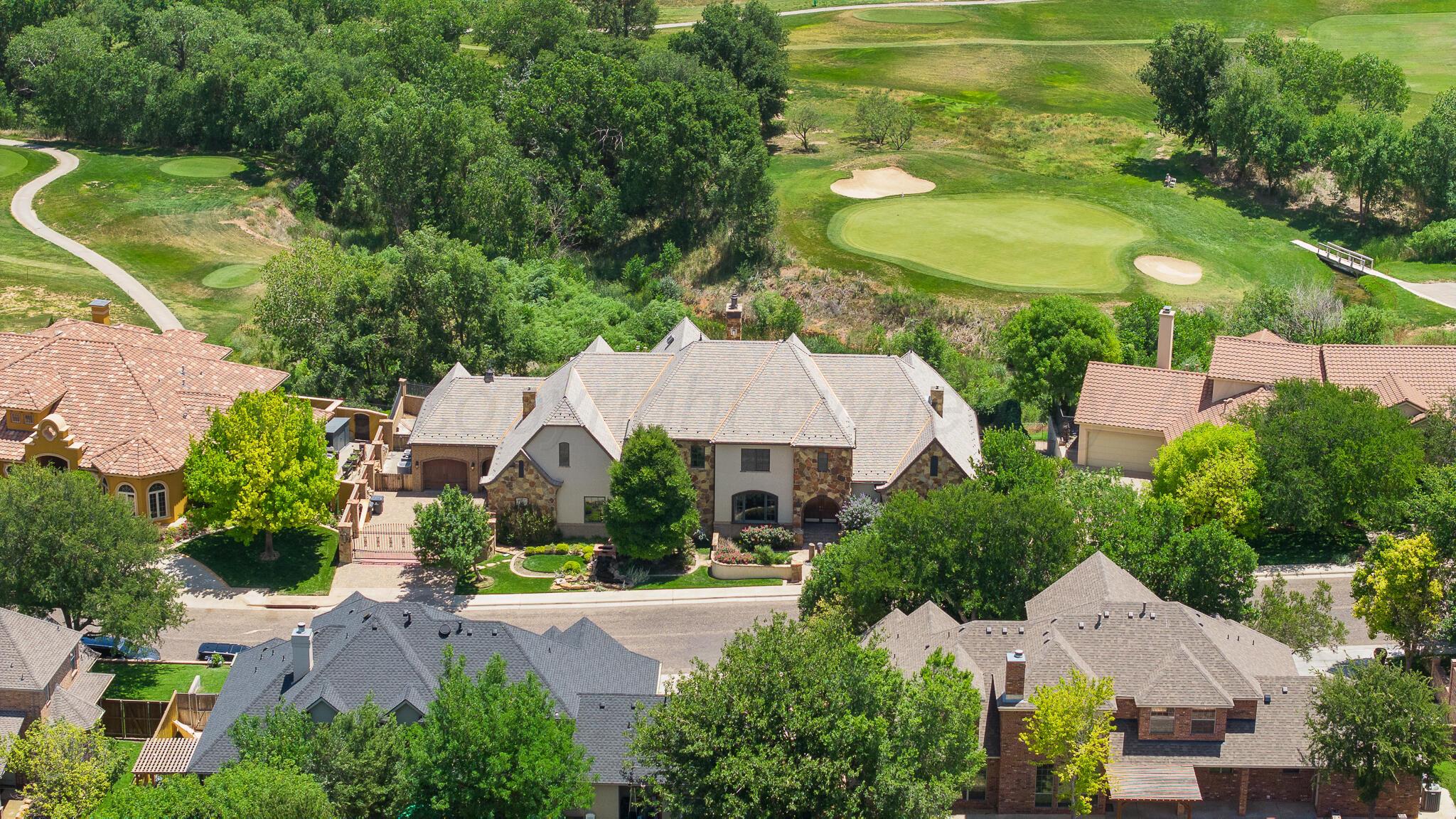 an aerial view of a house with yard swimming pool and outdoor seating
