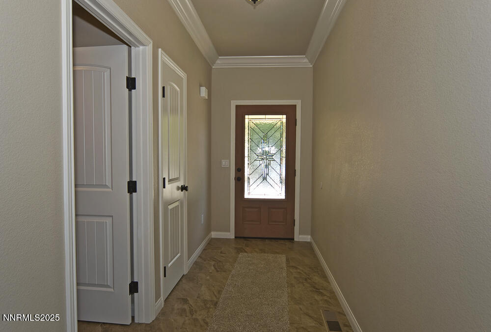 646 Anderson Street Carson City, NV 89701 - Photo 2 of 25 a view of a hallway with a wooden door