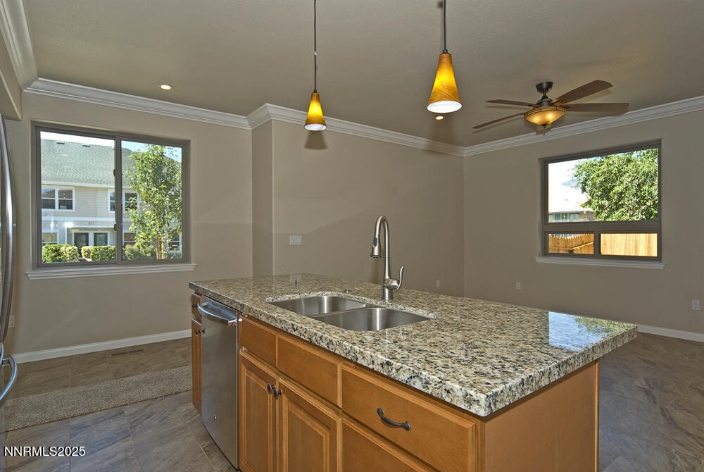646 Anderson Street Carson City, NV 89701 - Photo 7 of 25 a kitchen area with granite countertop a sink and window