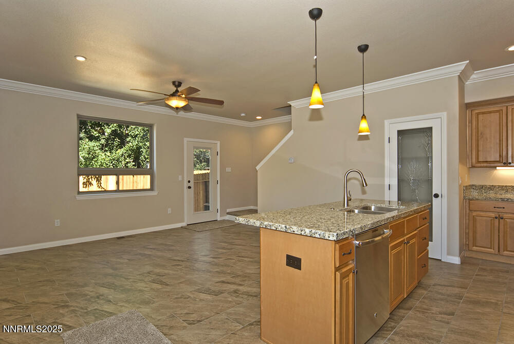 646 Anderson Street Carson City, NV 89701 - Photo 8 of 25 a kitchen with stainless steel appliances granite countertop a sink a stove and a refrigerator