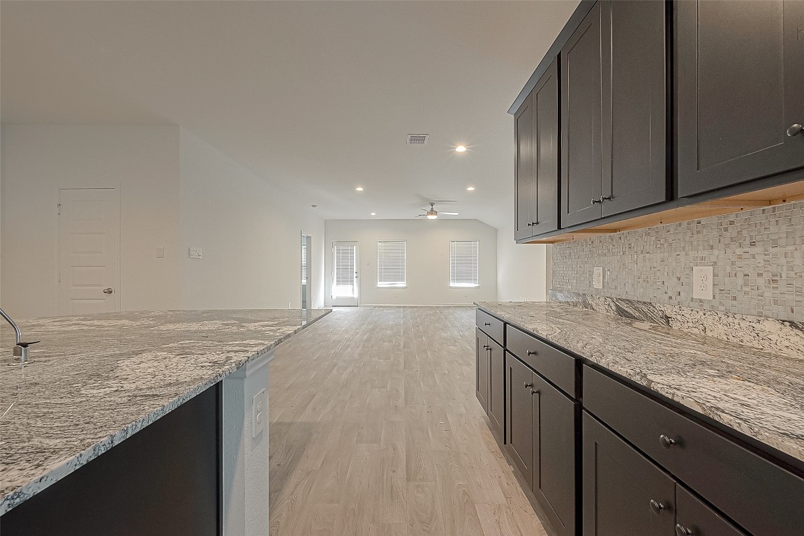 2731 Willow Gulch Way Rosenberg, TX 77469 - Photo 19 of 50 a view of a kitchen with granite countertop cabinets