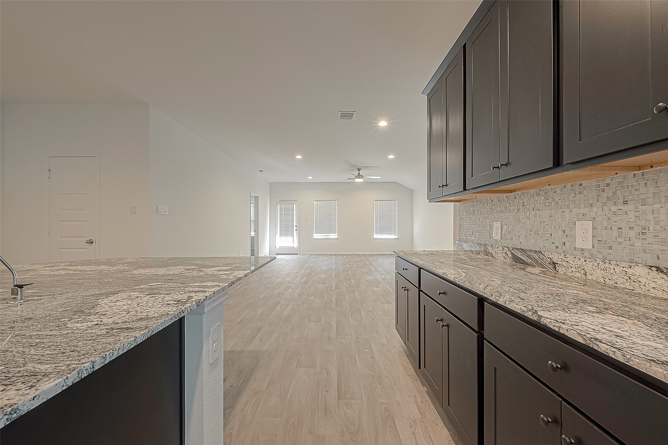2731 Willow Gulch Way Rosenberg, TX 77469 - Photo 19 of 50 a view of a kitchen with granite countertop cabinets
