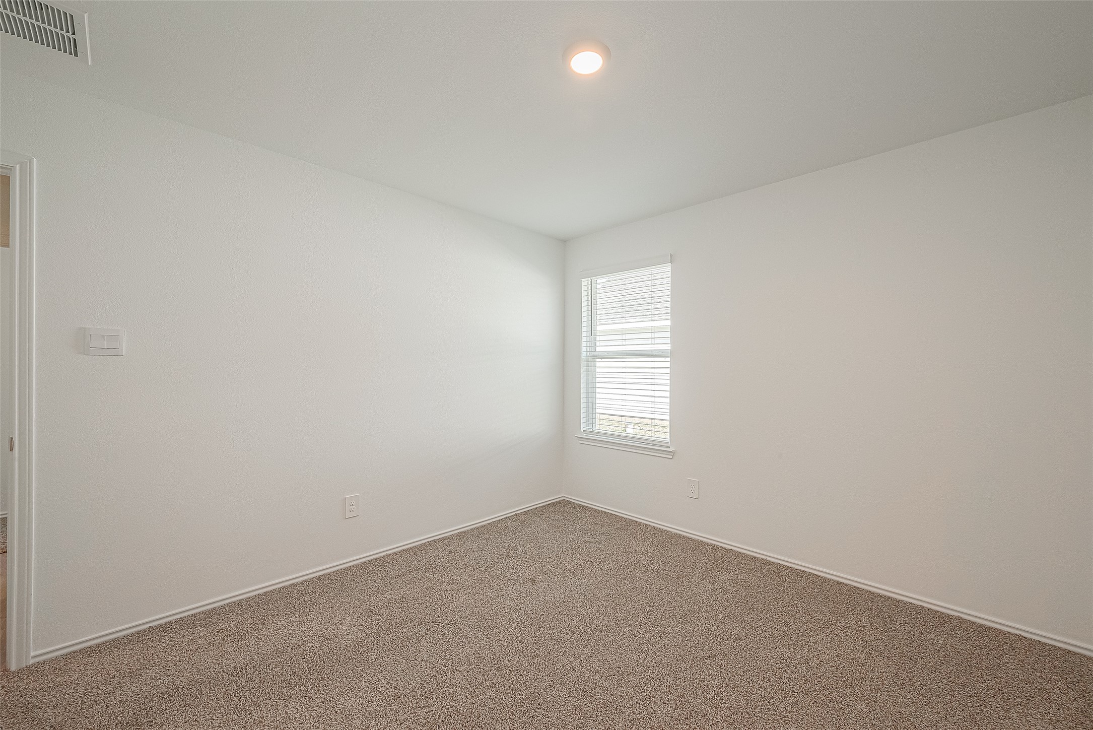2731 Willow Gulch Way Rosenberg, TX 77469 - Photo 33 of 50 an empty room with a window