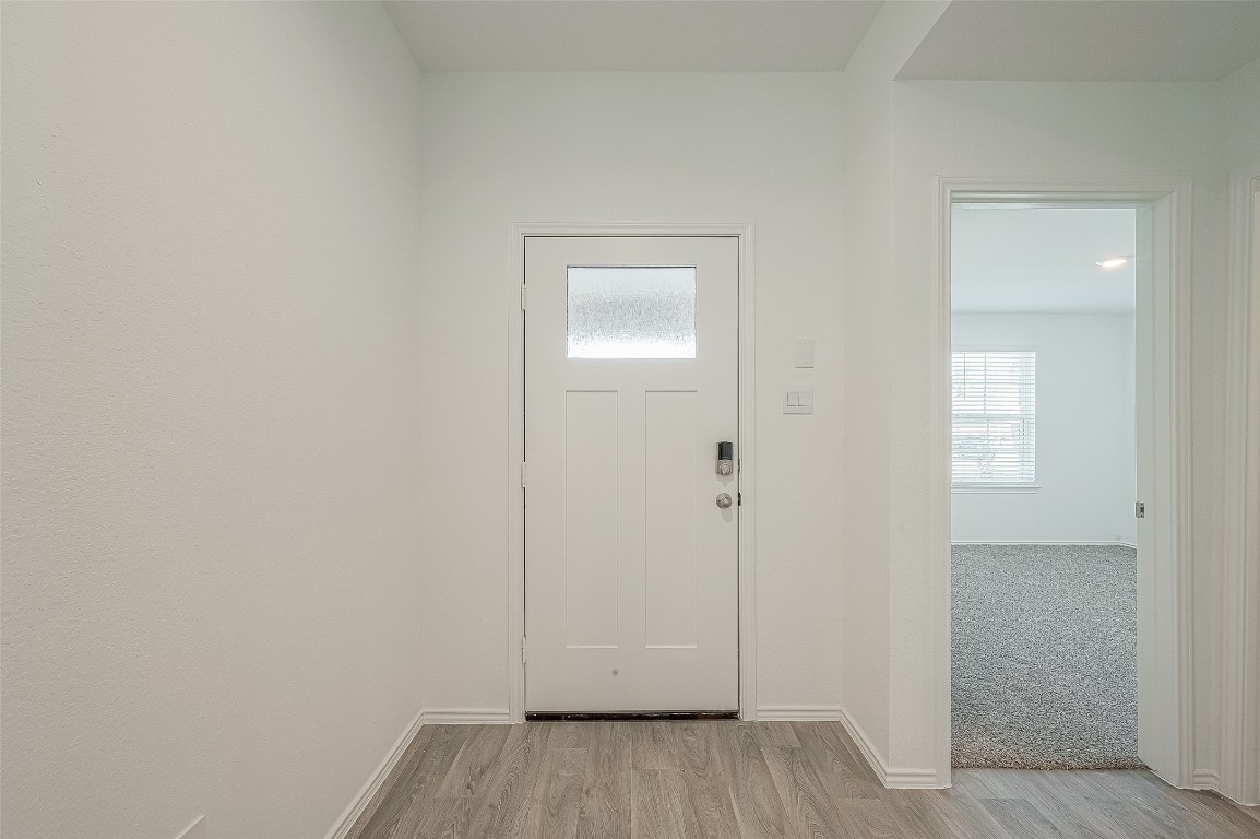 2731 Willow Gulch Way Rosenberg, TX 77469 - Photo 7 of 50 an empty room with wooden floor and closet