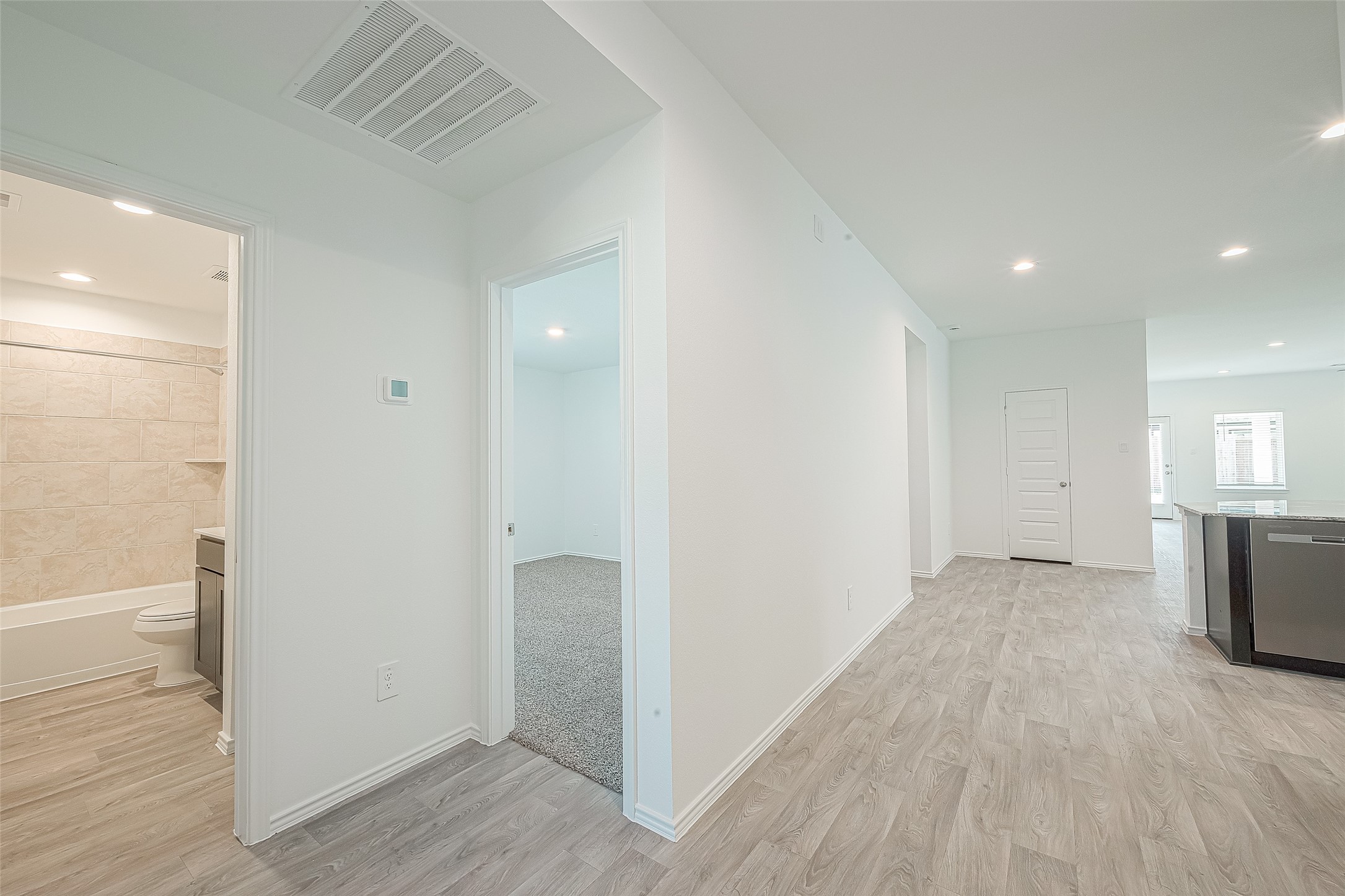 2731 Willow Gulch Way Rosenberg, TX 77469 - Photo 9 of 50 a view of a room with wooden floor and a bathroom