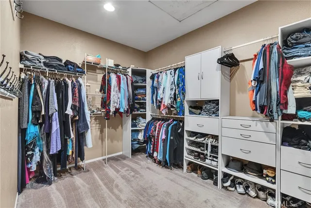 a spacious bathroom with a granite countertop tub sink a mirror a shower and vanity