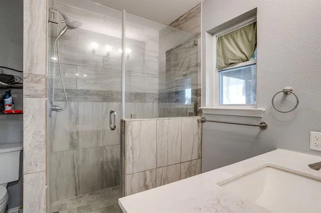 a open kitchen with stainless steel appliances granite countertop a lot of counter space and wooden floors