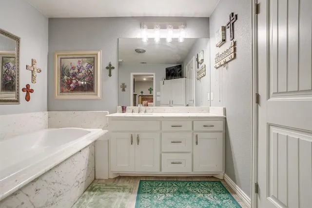 a swimming pool with an outdoor space and seating area