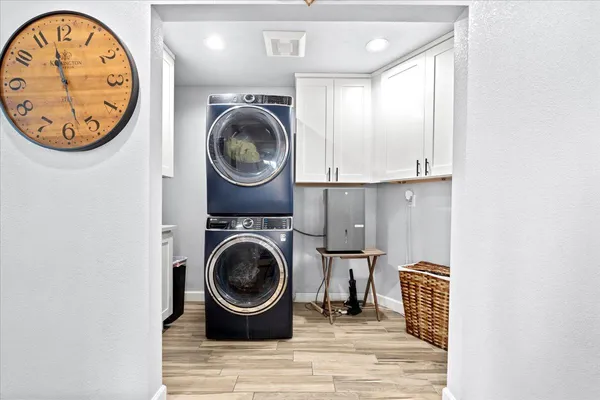 a view of a hallway with washer and dryer
