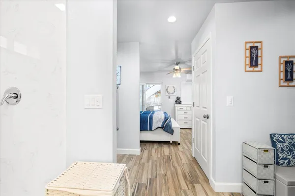 a view of bedroom with wooden floor