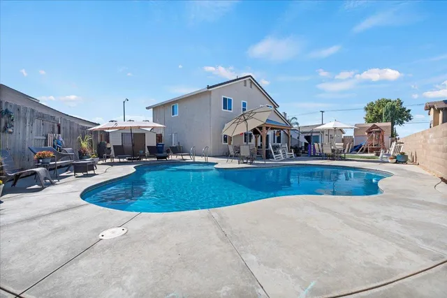 a view of a swimming pool with a patio