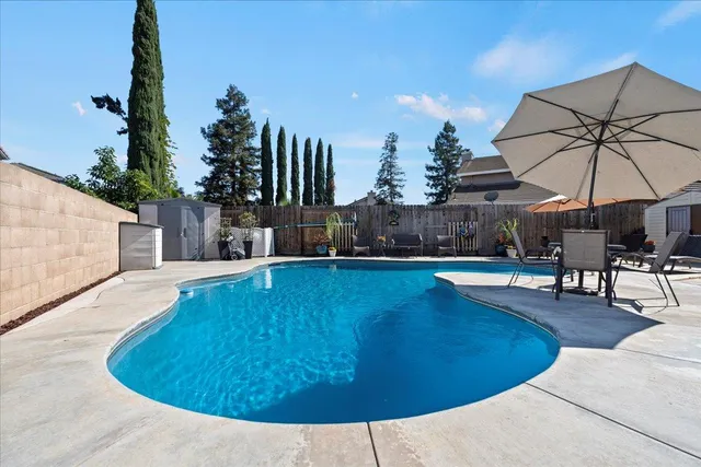 a swimming pool view with a outdoor space
