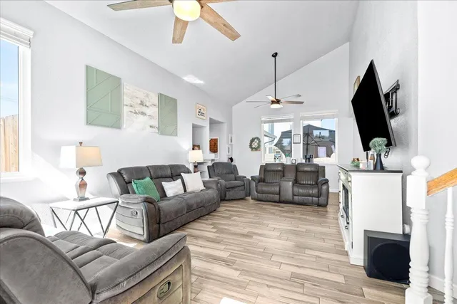 a living room with furniture and a flat screen tv