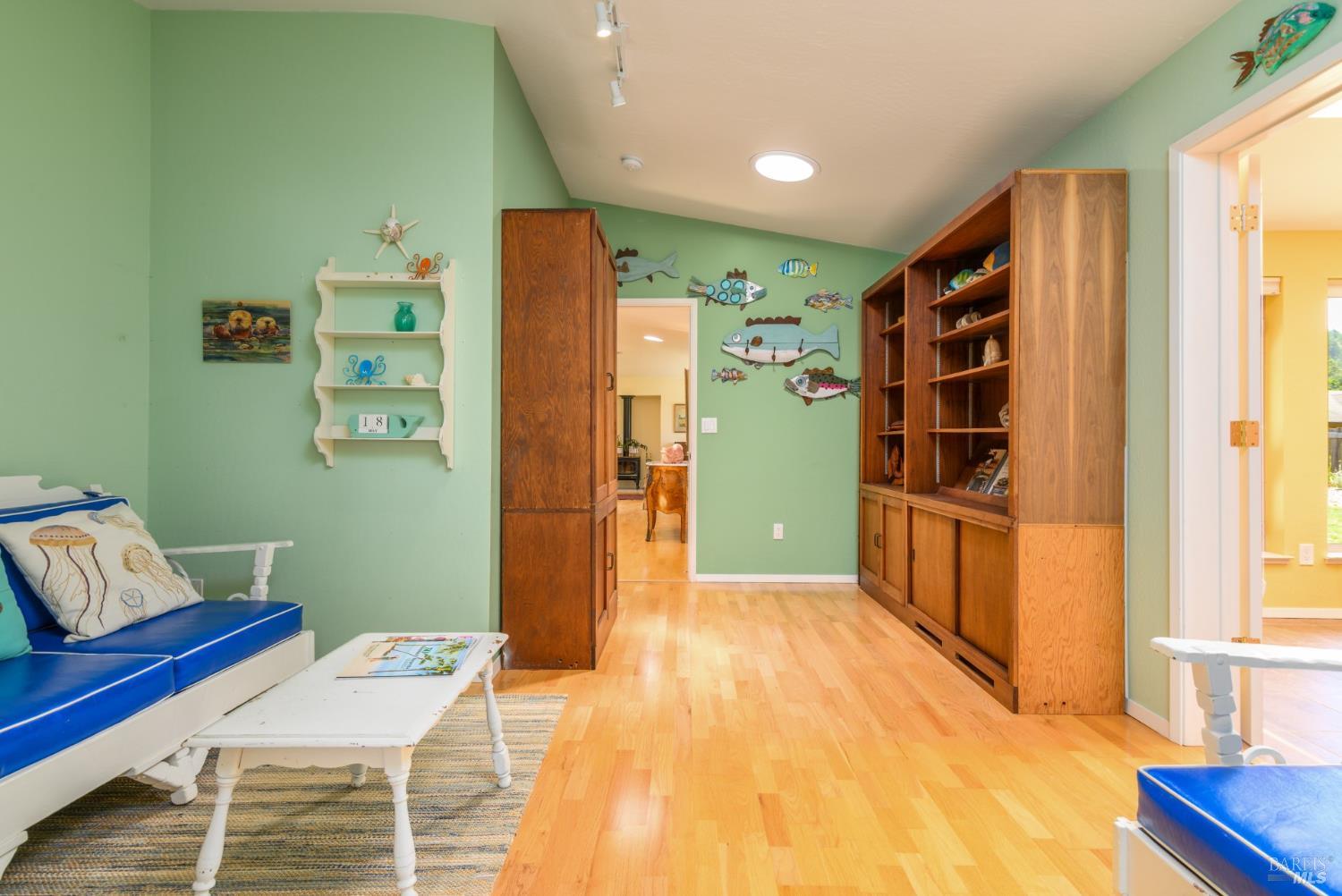 15721 Forest View Road Manchester, CA 95459 - Photo 35 of 50 The office/tv room is central to the home, and offers many opportunities for living. With Golden Oak flooring and storage...