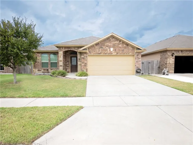 a front view of a house with yard