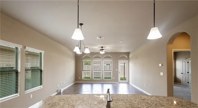 a view of room with a ceiling fan