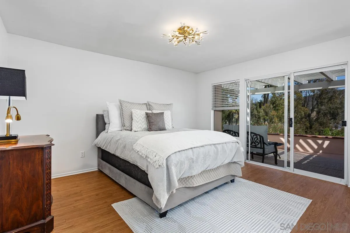 1201 Rue St Jean San Marcos, CA 92078 - Photo 19 of 73 a bed sitting in a bedroom next to a window