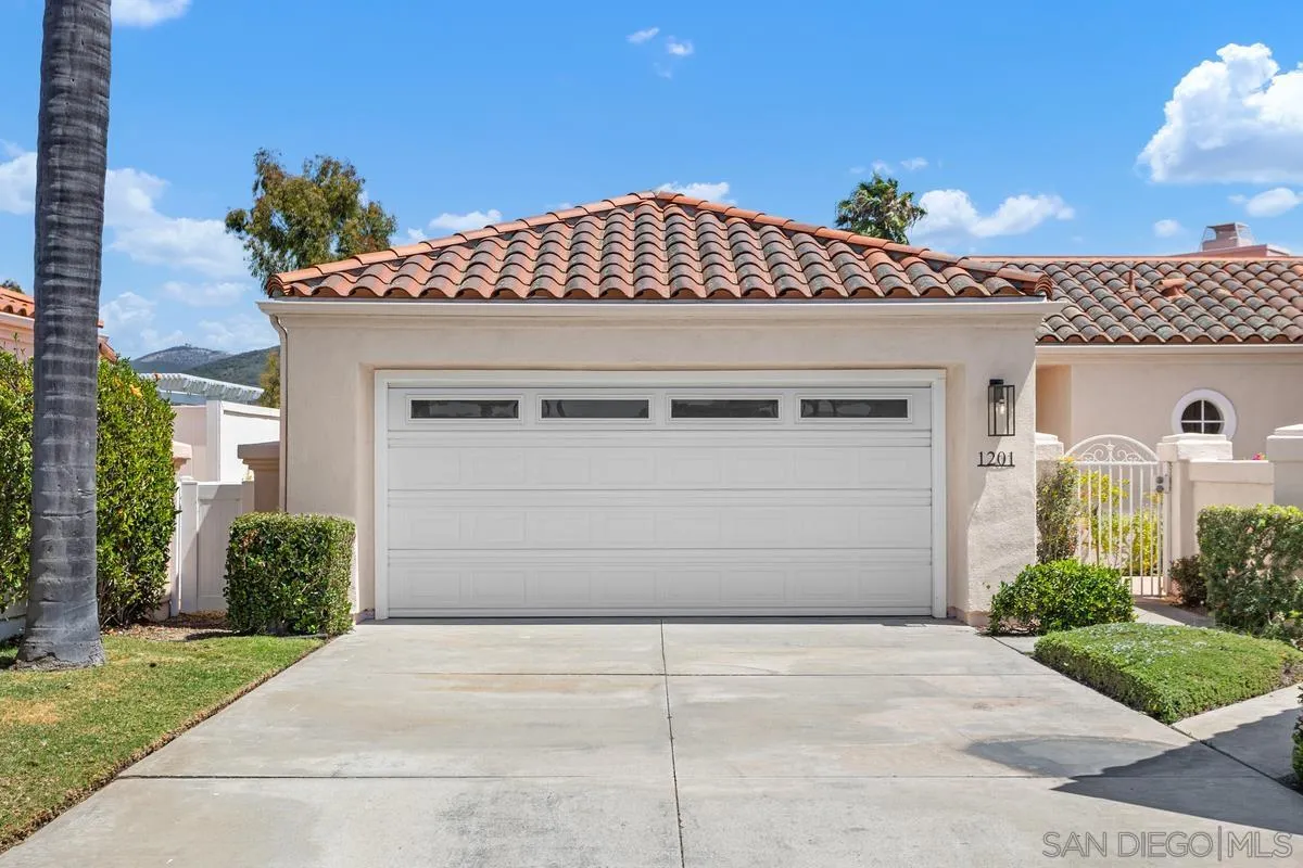 1201 Rue St Jean San Marcos, CA 92078 - Photo 2 of 73 a front view of a house with a garage