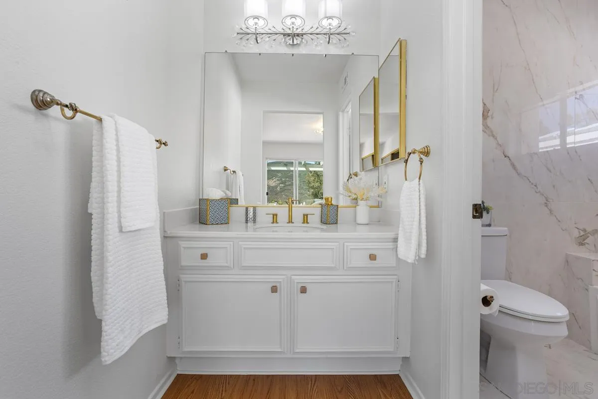1201 Rue St Jean San Marcos, CA 92078 - Photo 22 of 73 a bathroom with a sink a toilet and shower