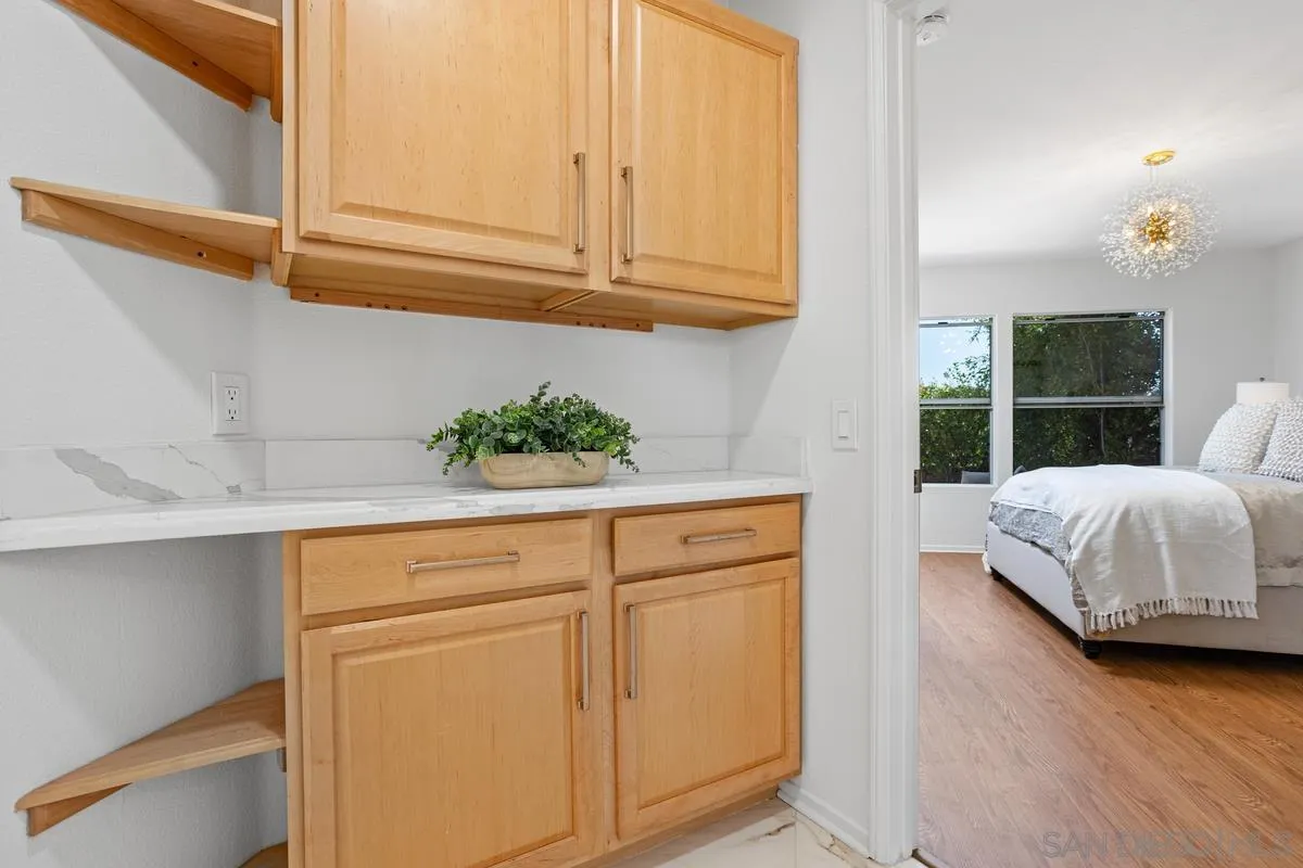 1201 Rue St Jean San Marcos, CA 92078 - Photo 28 of 73 a bedroom with a bed and a potted plant