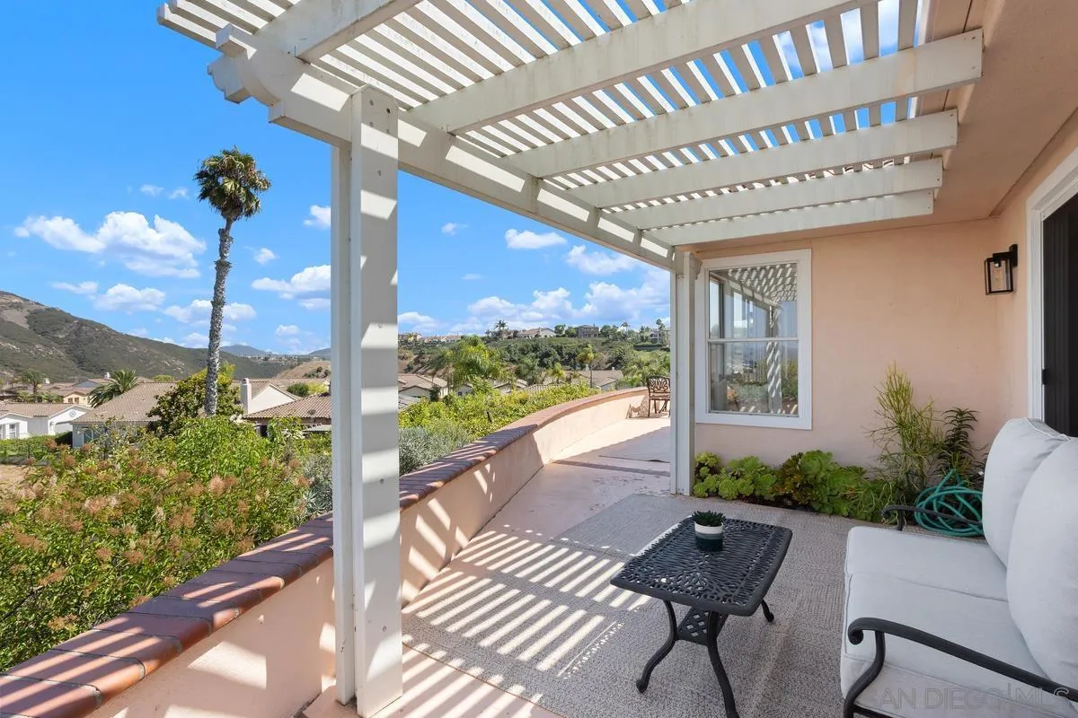 1201 Rue St Jean San Marcos, CA 92078 - Photo 39 of 73 a view of a porch with chairs and potted plants