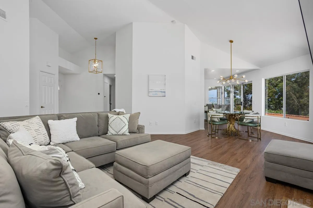 1201 Rue St Jean San Marcos, CA 92078 - Photo 6 of 73 a living room with furniture and a chandelier
