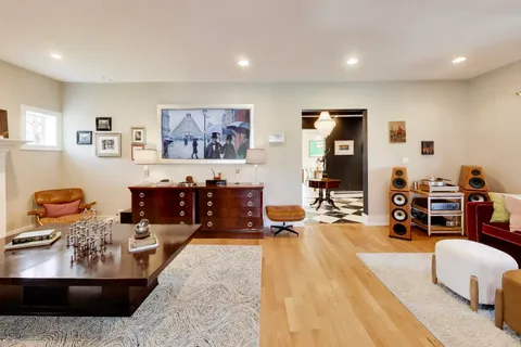 a dining room with furniture and window