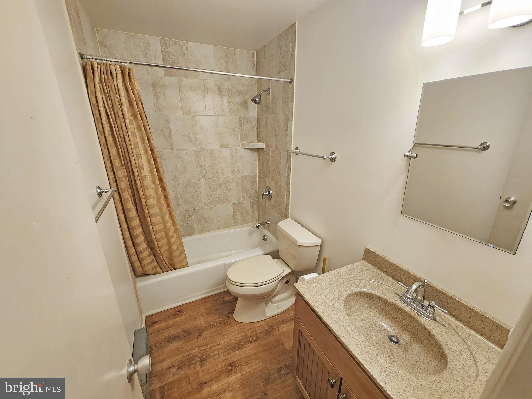12 77th Street, Unit 103 Ocean City, MD 21842 - Photo 10 of 14 a bathroom with a sink toilet and shower