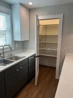 a kitchen with a sink and a window