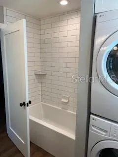 a bathroom with a bathtub and a shower
