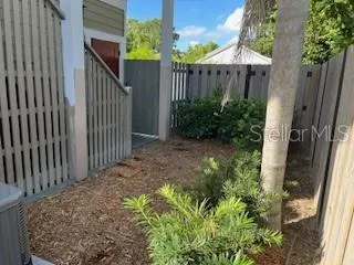 a view of a house with a flower garden
