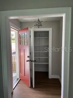 a view of walk in closet with empty racks