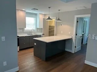 a bathroom with a sink vanity and a mirror