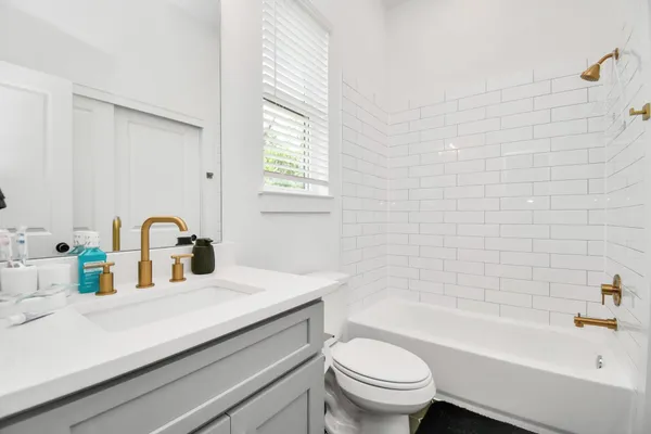 a bathroom with a sink a toilet and a bathtub