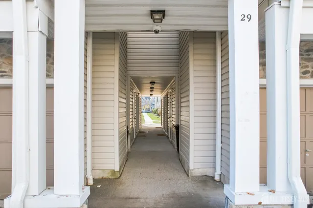 a view of a hallway with a white door